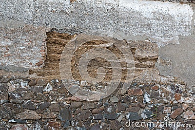 Old stone wall collapsing Stock Photo