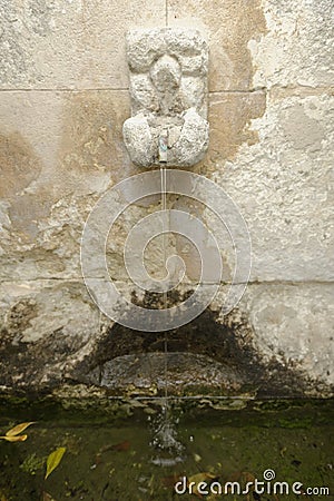 Old stone water fountain Stock Photo