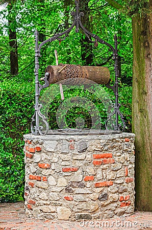 Old stone water well Stock Photo