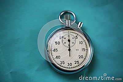 Old stopwatch isolated on wooden background Stock Photo