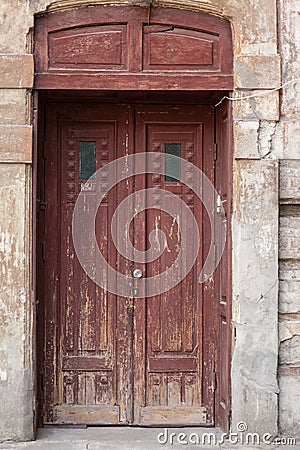 Old street brown vintage wooden doors with a glass Stock Photo