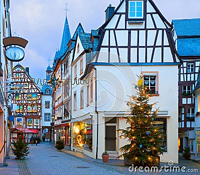 Old street decorated for Christmas in the historic center of Bernkastel-Kues, Rhineland-Palatinate, Germany. Toned image Stock Photo