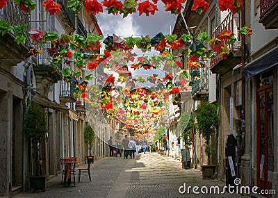 Old street decorated with flowers Editorial Stock Photo