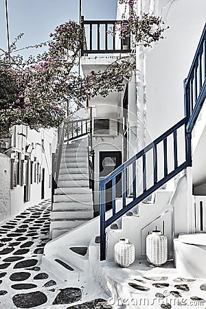 Old street with whitewashed houses in Mykonos Stock Photo