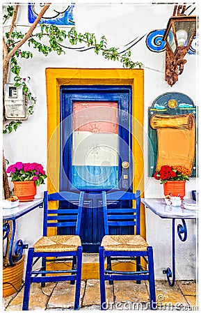 Traditional street colorful bars and tavernas of Greece Stock Photo