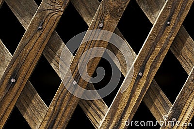 Old strip board diagonals with metal spikes Stock Photo