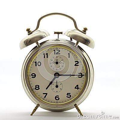 Old style alarm clock, metal, it`s quarter past seven. Stock Photo