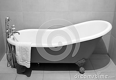 Old style bath tub with metal legs Stock Photo