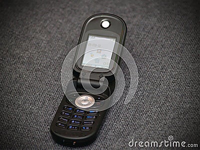 Old style classic black flip cellular phone Stock Photo