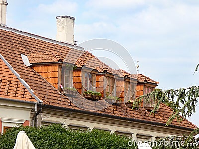 old style dormer windows with terracotta tiles Stock Photo