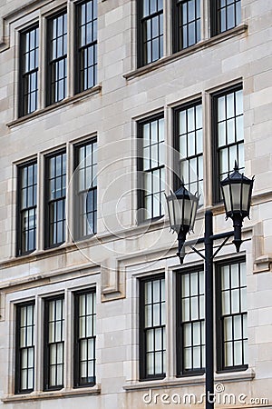 Light pole in front of windows Stock Photo