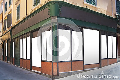 An old style shop in green iron with customizable blank windows Editorial Stock Photo
