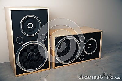 Old style stereo speakers on concrete floor Stock Photo