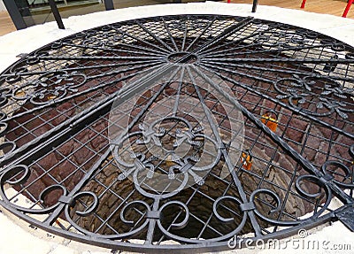 old style wrought iron covered well Stock Photo