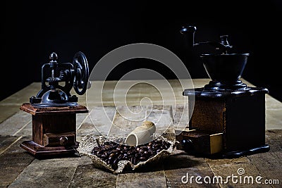 Old stylish grinder for grinding tasty coffee on an old wooden t Stock Photo