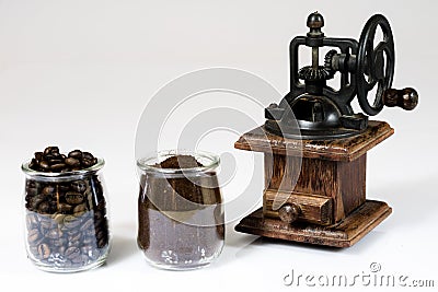 Old stylish grinder for grinding tasty coffee on white isolated Stock Photo