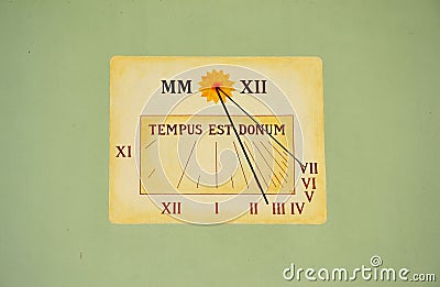 Old sun dial on wall Stock Photo