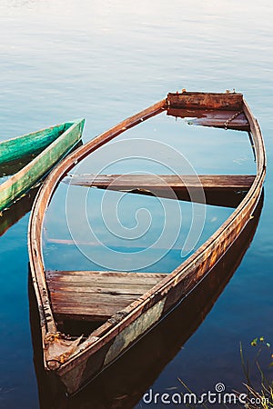 Old Sunken Wooden Fishing Boat In River. Belarus Stock Photo