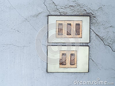 Old switch board with multiple plug switched socket Stock Photo