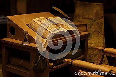 Old table with the ancient book Stock Photo