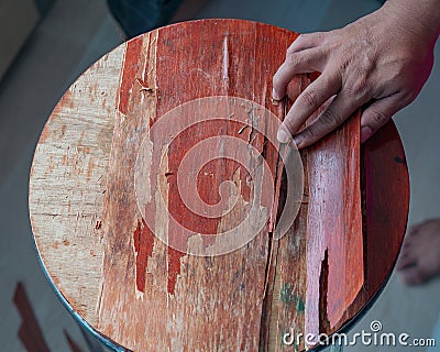 Old table laminated peel spokeshave exotic hardwood board chip shavings Stock Photo