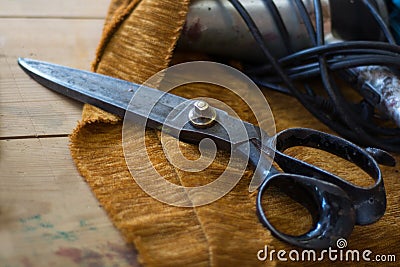 Old tailor scissors in a upholstery manufactory Stock Photo