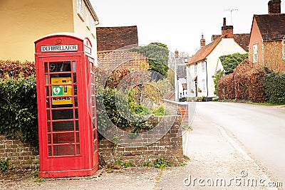 Old telephone box now reused as a defibrillator station Editorial Stock Photo