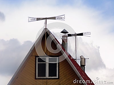 The old Television antenna on the house roof has a blue sky Stock Photo