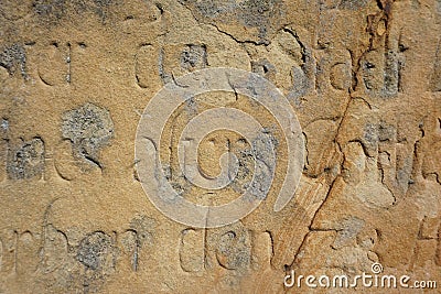 Old text engaved in sandstone Stock Photo