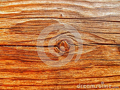 a piece of wood very cracked and with a knot in the center Stock Photo