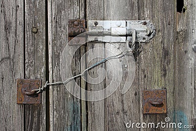 Old textured wood and bolt on an old shed Stock Photo