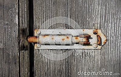 Old textured wood and grungy bolt Stock Photo