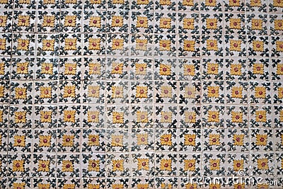 Old tiles wall on the street Portuguese painted tin-glazed, azulejos ceramic tilework. Porto Stock Photo