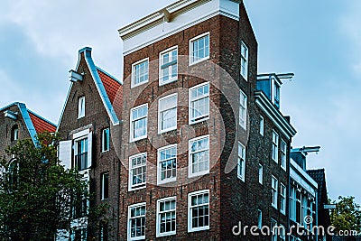 Old Tilted Houses in Amsterdam. Unique dutch architecture Stock Photo