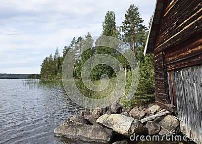 Old timbered boathouse close to the sea shore Stock Photo