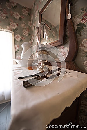 Old time crimper and lamp Editorial Stock Photo