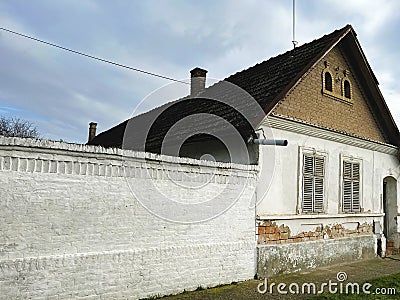 Old timeworn rustic house, typical architectural style for 19th century architecture in Vojvodina Stock Photo