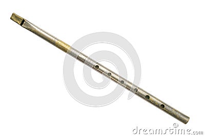 Old tin whistle aka penny whistle, isolated on white. Stock Photo
