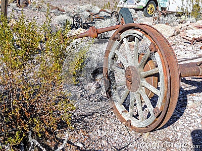 Old tires with metal Wagon wheel spikes in the desert in Arizona in a deserted ghost mining town. Stock Photo