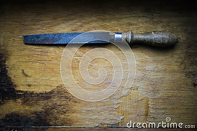 Old tool on a wooden board Stock Photo