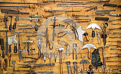 Old tools on the wall Stock Photo