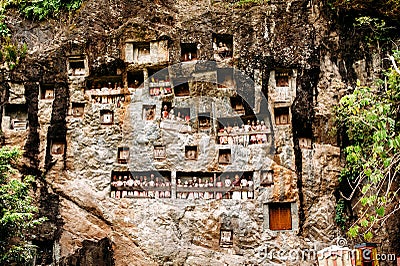 Old torajan burial site in Lemo, Tana Toraja. The cemetery with coffins placed in caves. Rantapao, Sulawesi, Indonesia Stock Photo