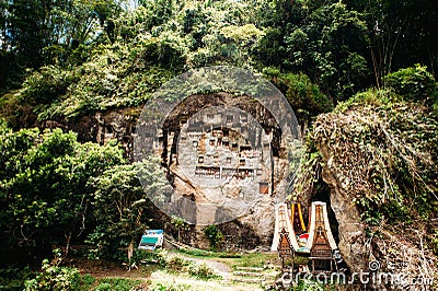 Old torajan burial site in Lemo, Tana Toraja, Sulawesi, Indonesia. The cemetery with coffins placed in caves Stock Photo