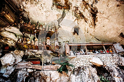 Old torajan burial site in Londa, Tana Toraja, Indonesia. The cemetery with coffins placed in cave Stock Photo