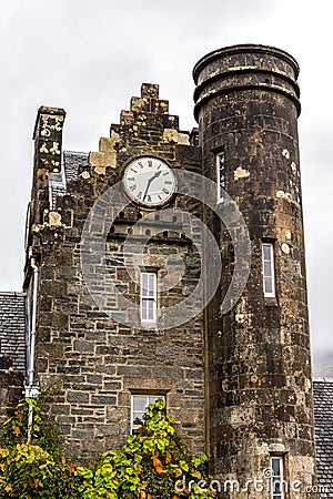 An old tower building with clock at Benmore Botanic Garden, Scotland Editorial Stock Photo