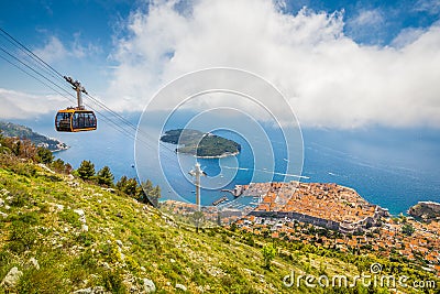 Old town of Dubrovnik with cable car ascending Srd mountain, Dalmatia, Croatia Stock Photo