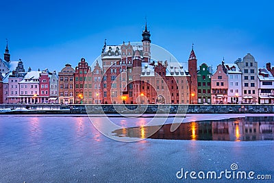 Old town of Gdansk over Motlawa river at snowy dawn. Poland Stock Photo