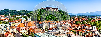 Old town and the medieval Ljubljana castle on top of a forest hill in Ljubljana, Slovenia Stock Photo