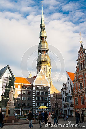 Old town square in the center of Riga, Latvia. Tourist attractions House of Blackheads and St Peters church Editorial Stock Photo