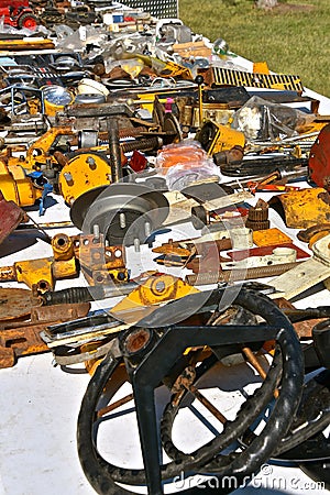 Machinery parts on the ground at a flea market Stock Photo